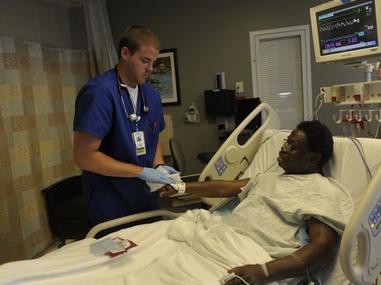 Sunny Owunah, an HCA patient, receives an anti-septic sponge bath to prevent a MRSA infection at TriStar Centennial in 2013